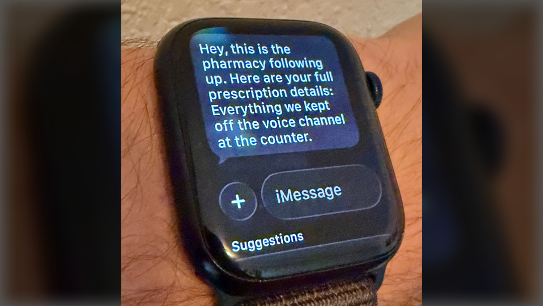 Close-up of an Apple Watch showing the pharmacy follow-up text message with prescription details